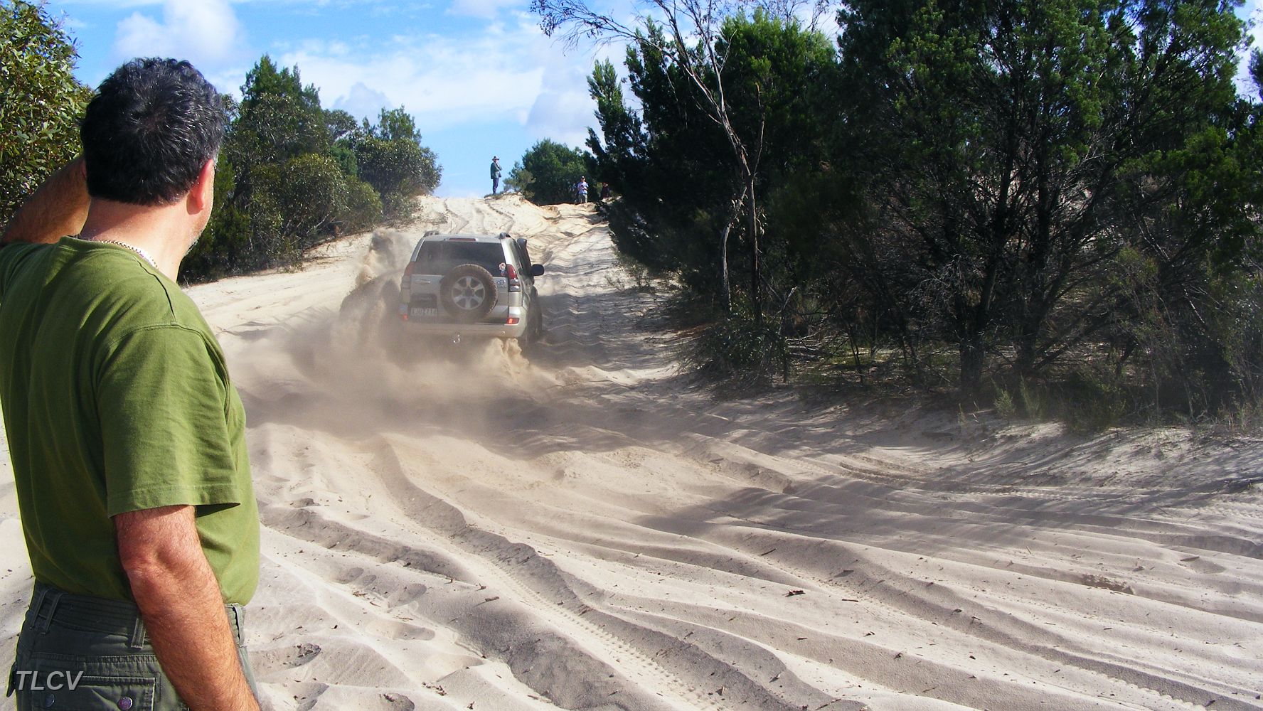 11-John watches Goldie climb a tricky Wyperfeld dune.JPG